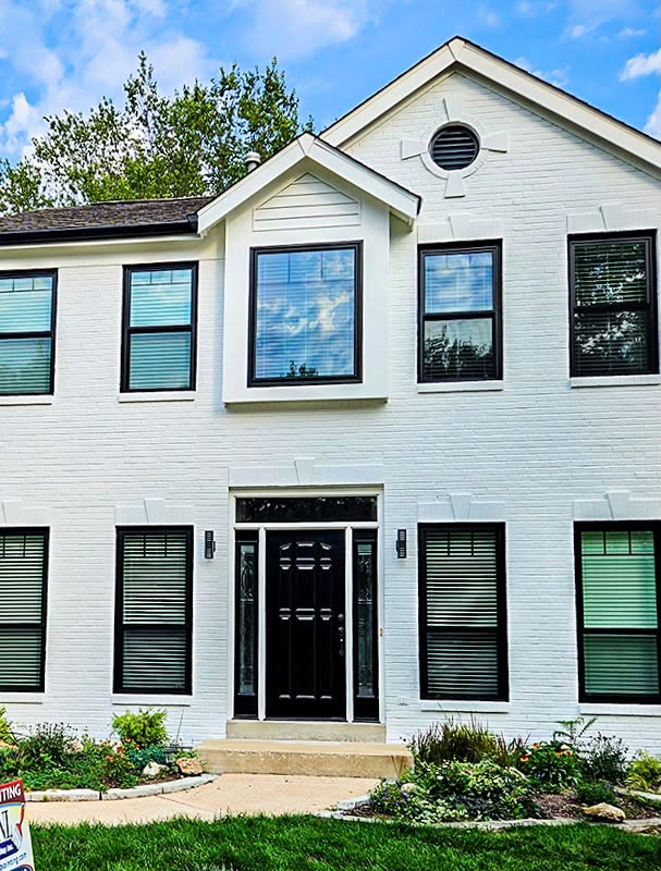 Freshly painted white colonial home exterior